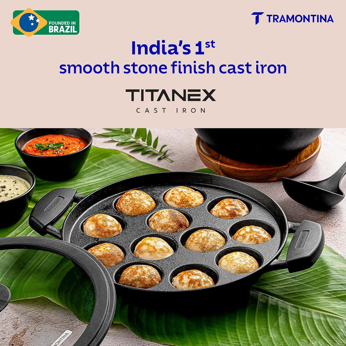 TRAMONTINA Titanex 26 cm Pre-Seasoned Cast Iron Paniyaram | Appe Pan – 12 Pits | Non-Toxic | Induction Ready | Toughned Glass Lid | Snap-on Cool Touch Grips | Superior Heat Retention.